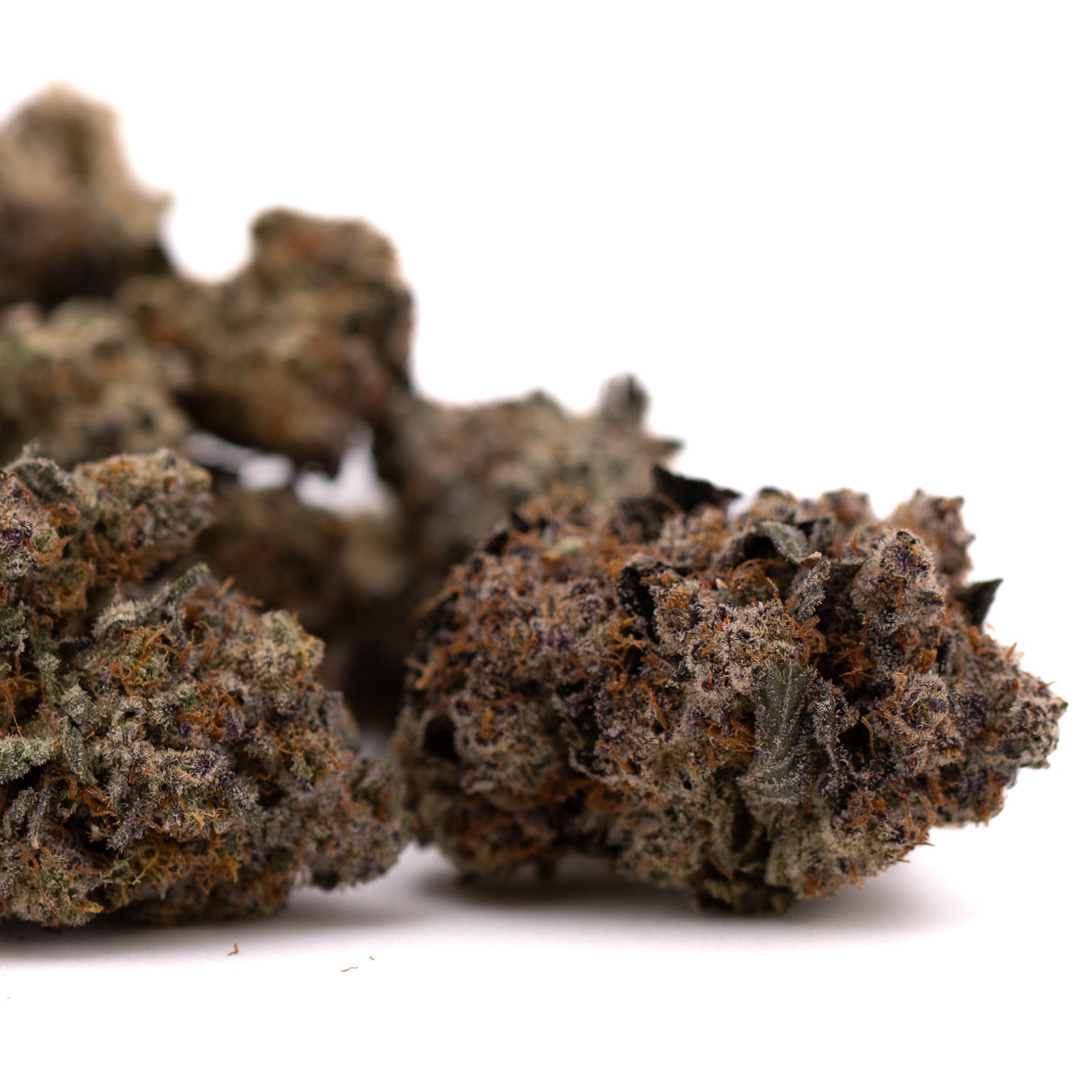 Dark reddish-brown Peach Tree THCa Indoor Flower hemp flower with trichomes