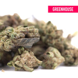 Poison gushers greenhouse smalls thca hemp flower with dense textured buds in green brown and purple hues