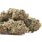 Lush dense greenhouse cultivated hemp flower with green and brown rozay cake buds covered in fine trichomes