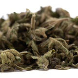 Dried green pound town full-term thca trim wholesale hemp flower with fuzzy texture and visible stems showing cannabinoid content