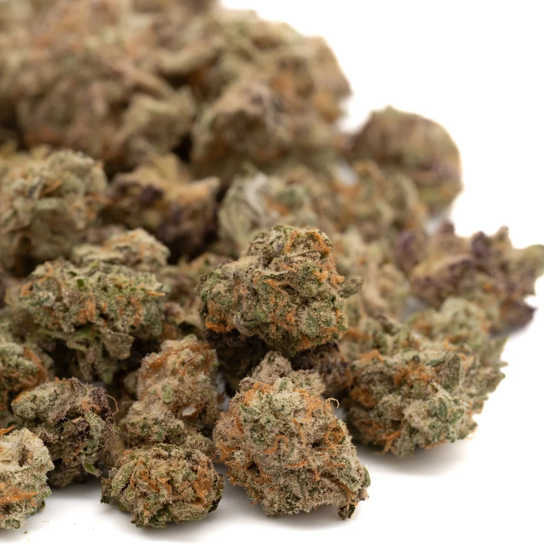 Premium Pressure THCa indoor hemp flower buds in a pile of THCa Smalls