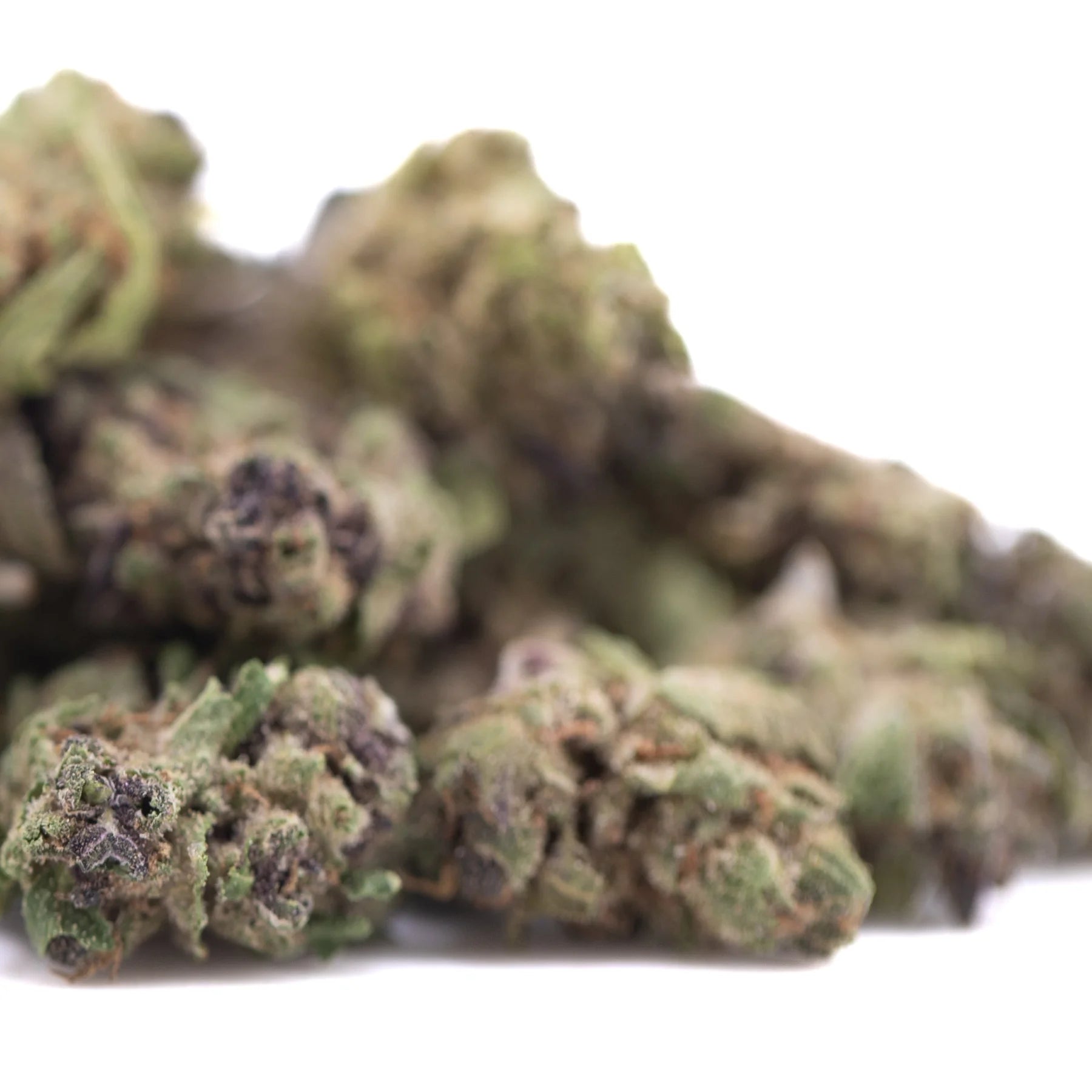 Green and purple cannabis buds with a dense, textured surface.