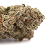 Purple Pop Rocks THCa hemp flower: green bud with white trichomes, pink hues, Greenhouse label