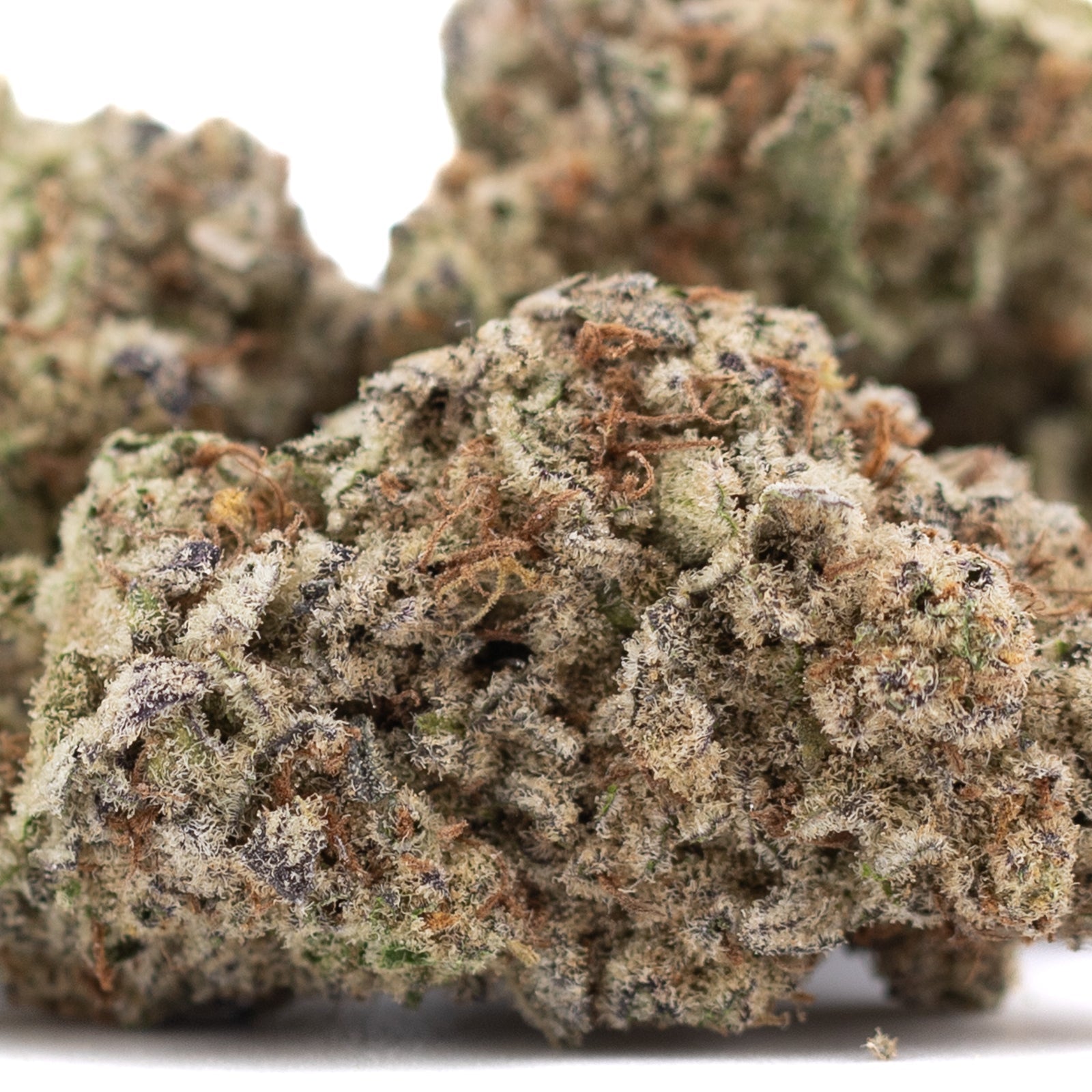 Purple Pop Rocks THCa hemp flower bud with green purple hues and trichomes