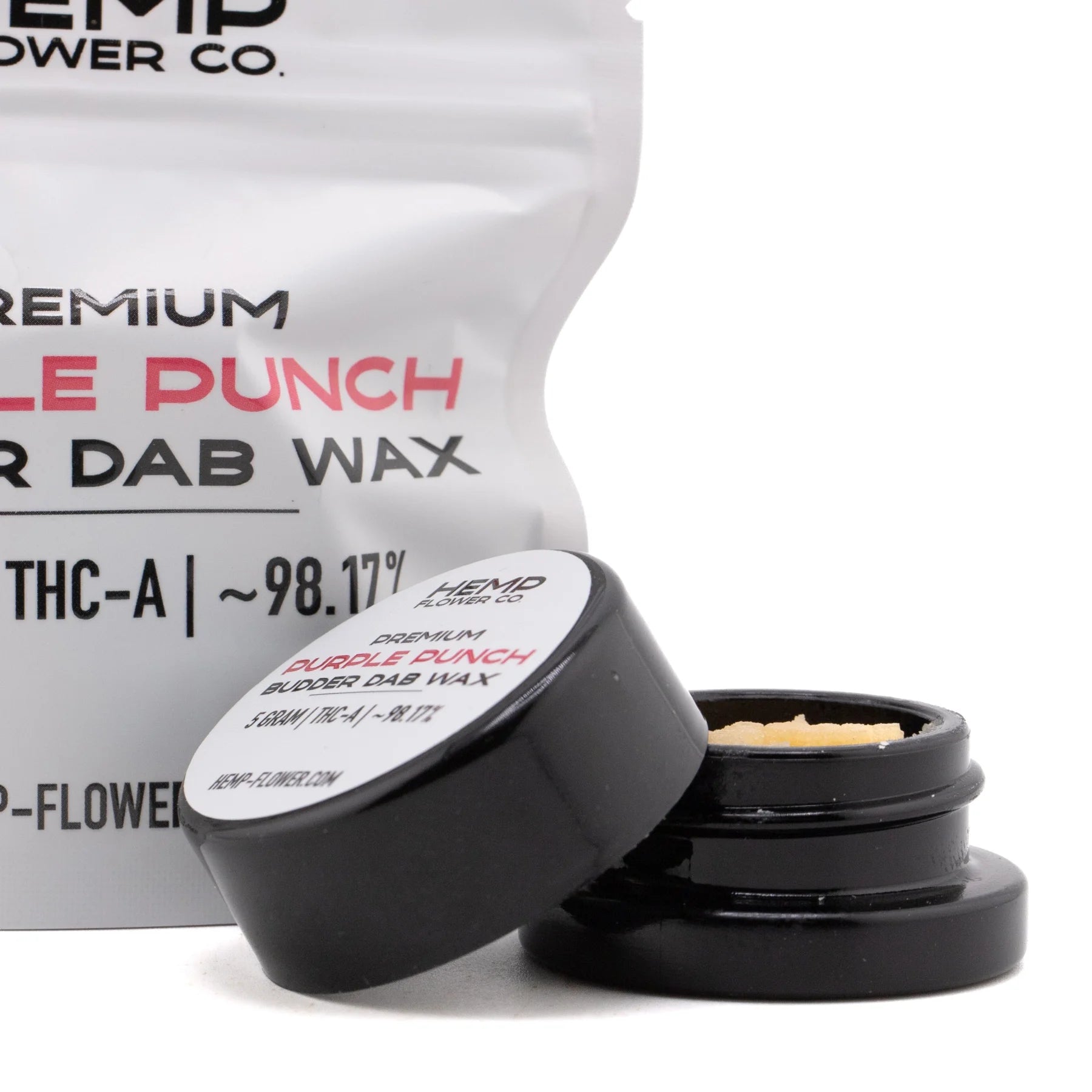 Black cylindrical container with white label showing premium purple punch thca budder wax holding light purple crystalline wax