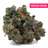 Purple Wedding Cake Indoor THCa Flower with purple hues, white trichomes, and orange pistils