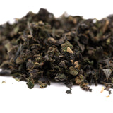 Dried dark green tea leaves with lighter accents for Purple Wedding Cake indoor trim or THCA trim