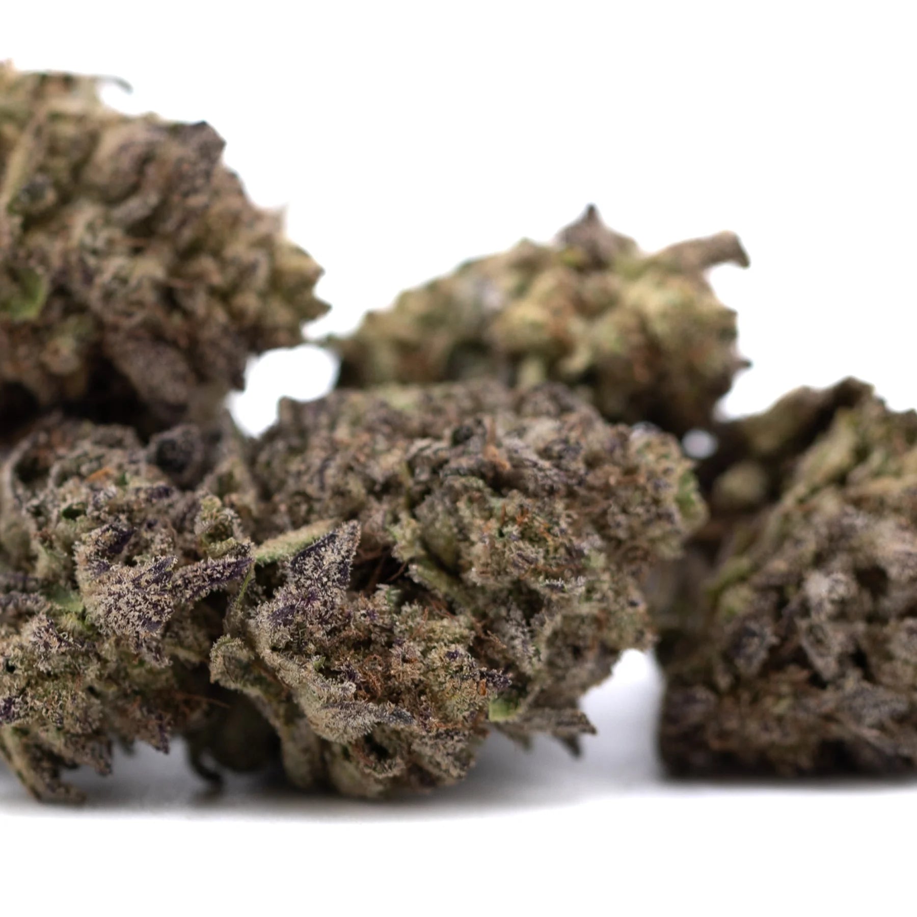 Mature purple wedding cake’s dense greenhouse thca flower buds with trichomes and subtle purple undertones