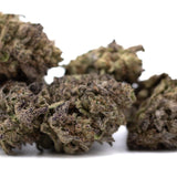 Mature purple wedding cake’s dense greenhouse thca flower buds with trichomes and subtle purple undertones