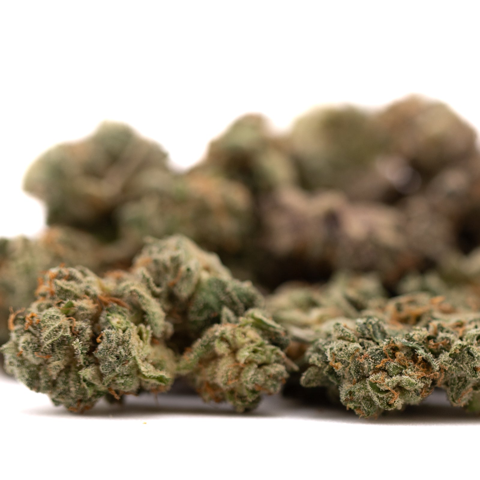 Pile of dried cannabis buds from Purple Wedding Indoor THCa Flower Smalls featuring wedding cake hemp flower