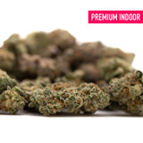 Purple Wedding Indoor THCa Flower Smalls featuring dried hemp flower with vibrant orange hairs