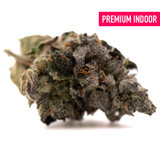 Dense frosty Rose Gold Runtz indoor THCA flower with purple and orange hues