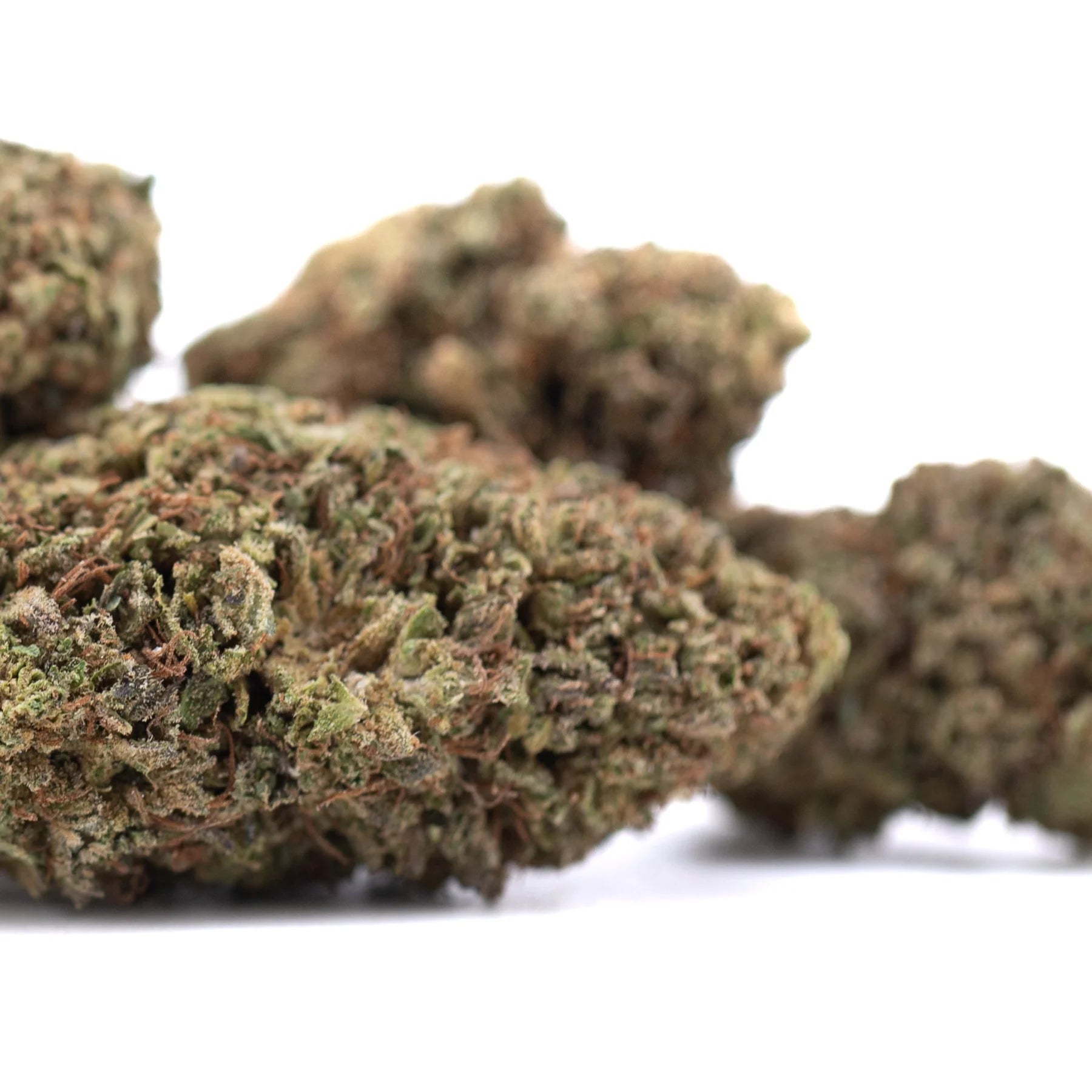 Green and brown royal og cbd full-term hemp flower buds with dense textured surface and high cannabinoid potency for cbd wholesale full-term use