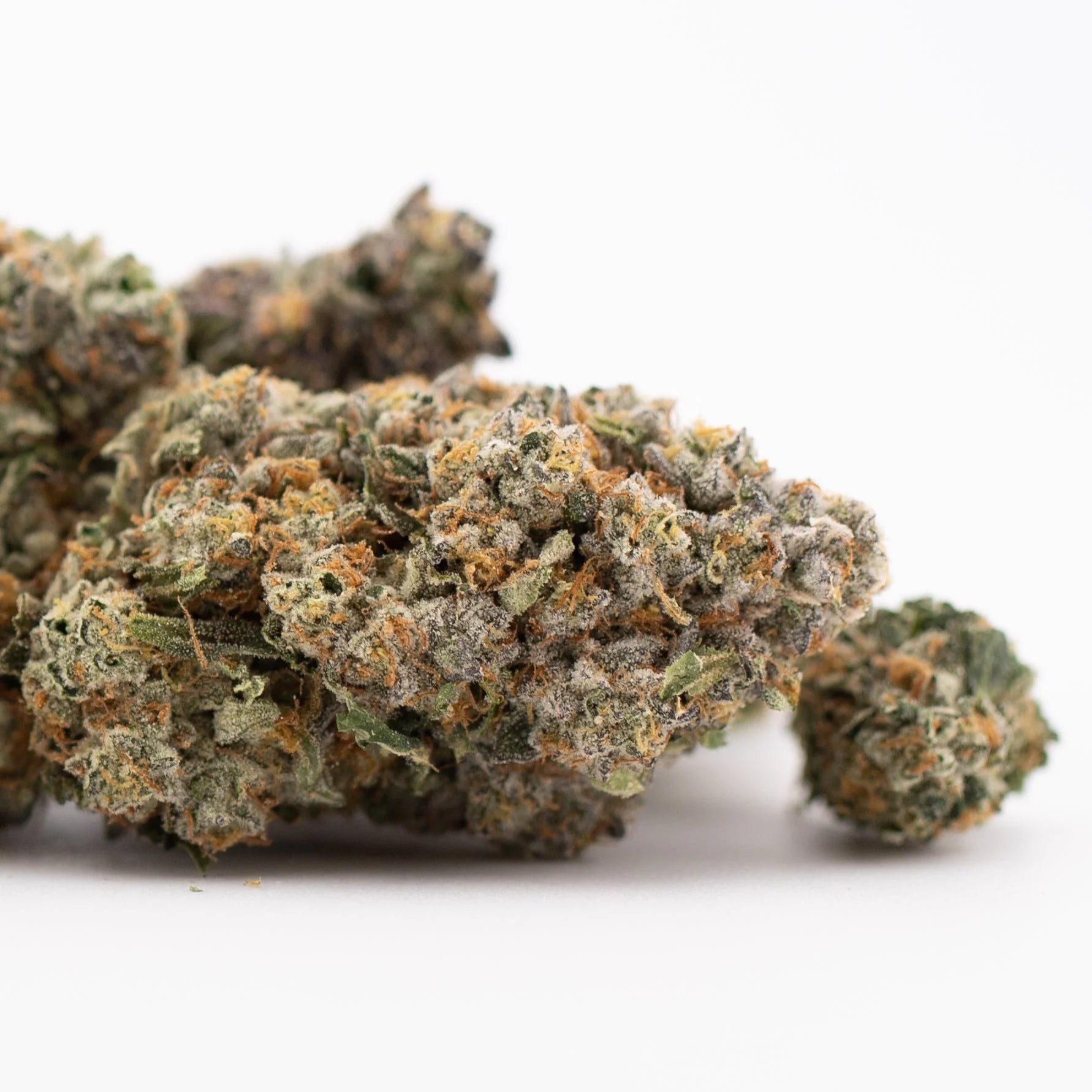 Premium Rozay Cake THCa hemp flower bud with purple-green hues and trichomes