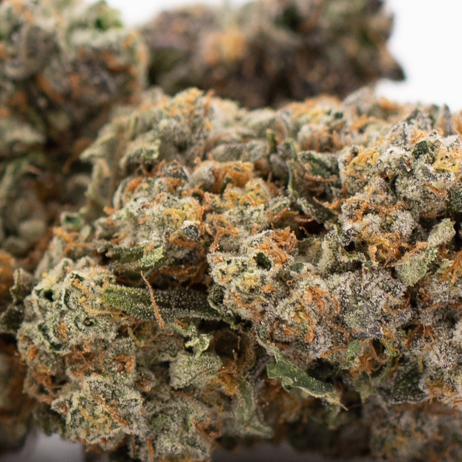 Premium Rozay Cake THCa Flower: Vibrant Green Orange Bud with Dense Trichomes