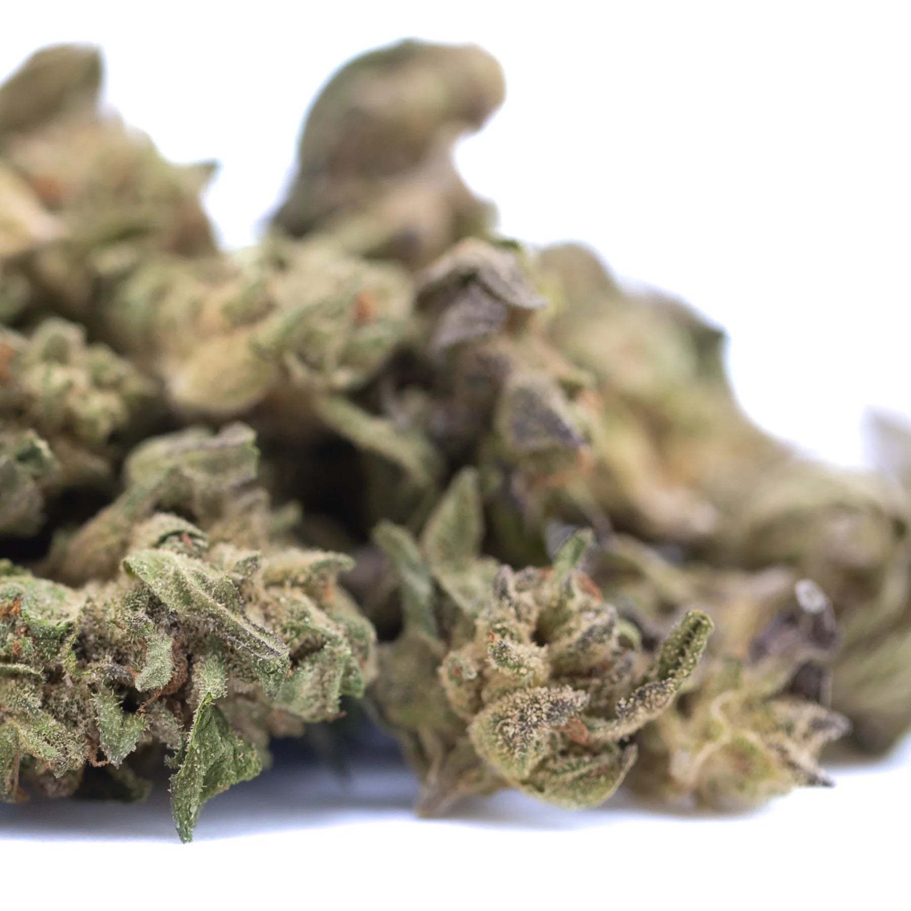 Dense green and brown rozay cake thca greenhouse smalls hemp flower bud with textured surface covered in trichomes