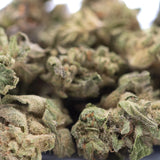 Dense green rozay cake hemp flower with textured surface and visible trichomes from wedding cake greenhouse smalls