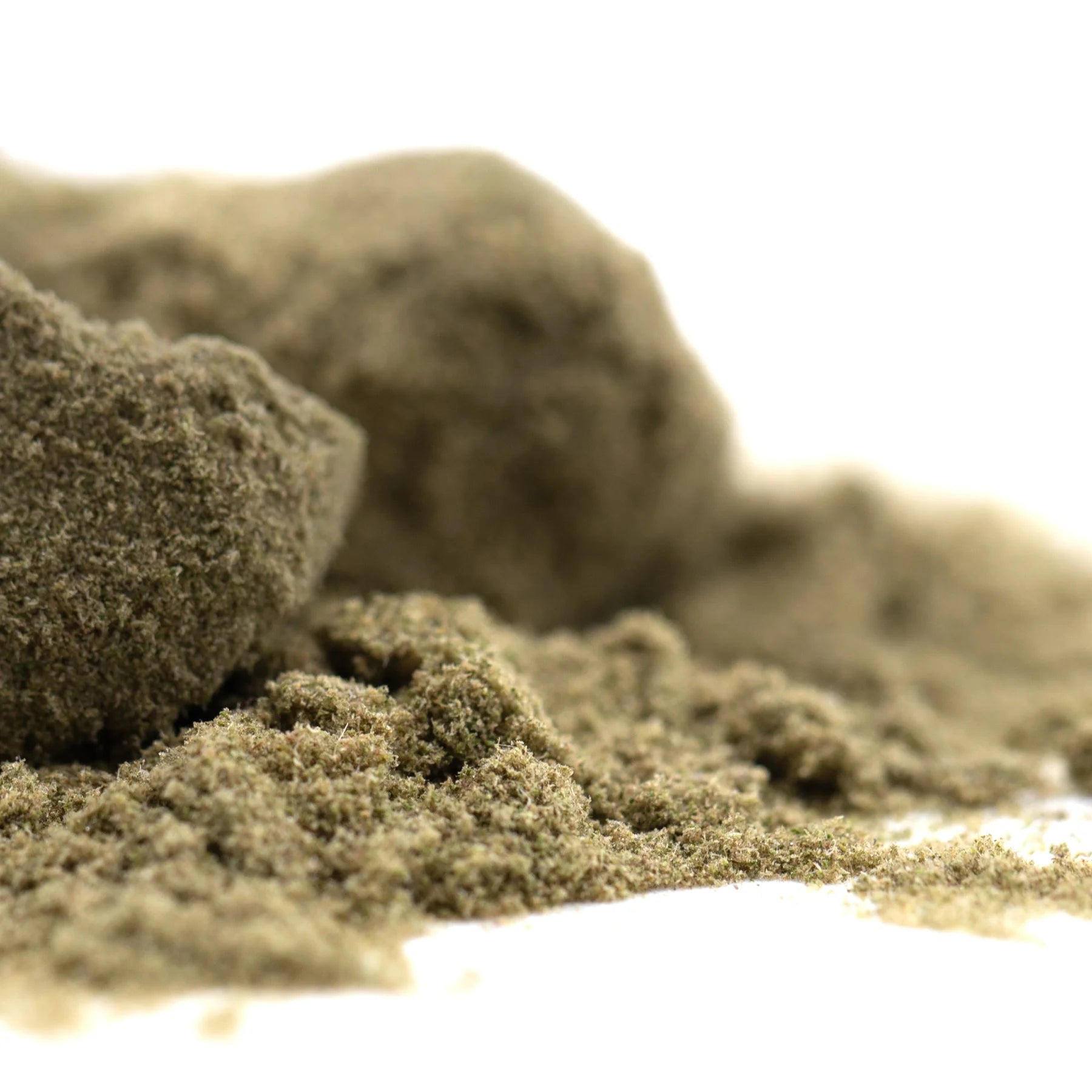 A mound of light brown thca kief with a textured surface for sour apple legendary sour diesel hemp flower use