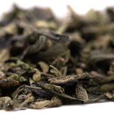 Loose leaf green tea with fuzzy dried leaves for Sour Candy Indoor Thca Trim terpene profile