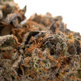 Southern Peaches THCa Flower with vibrant orange pistils and dense trichomes