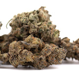 A dense textured space candy indoor thca flower bud with green and brown hues covered in fine trichomes for thca flower wholesale