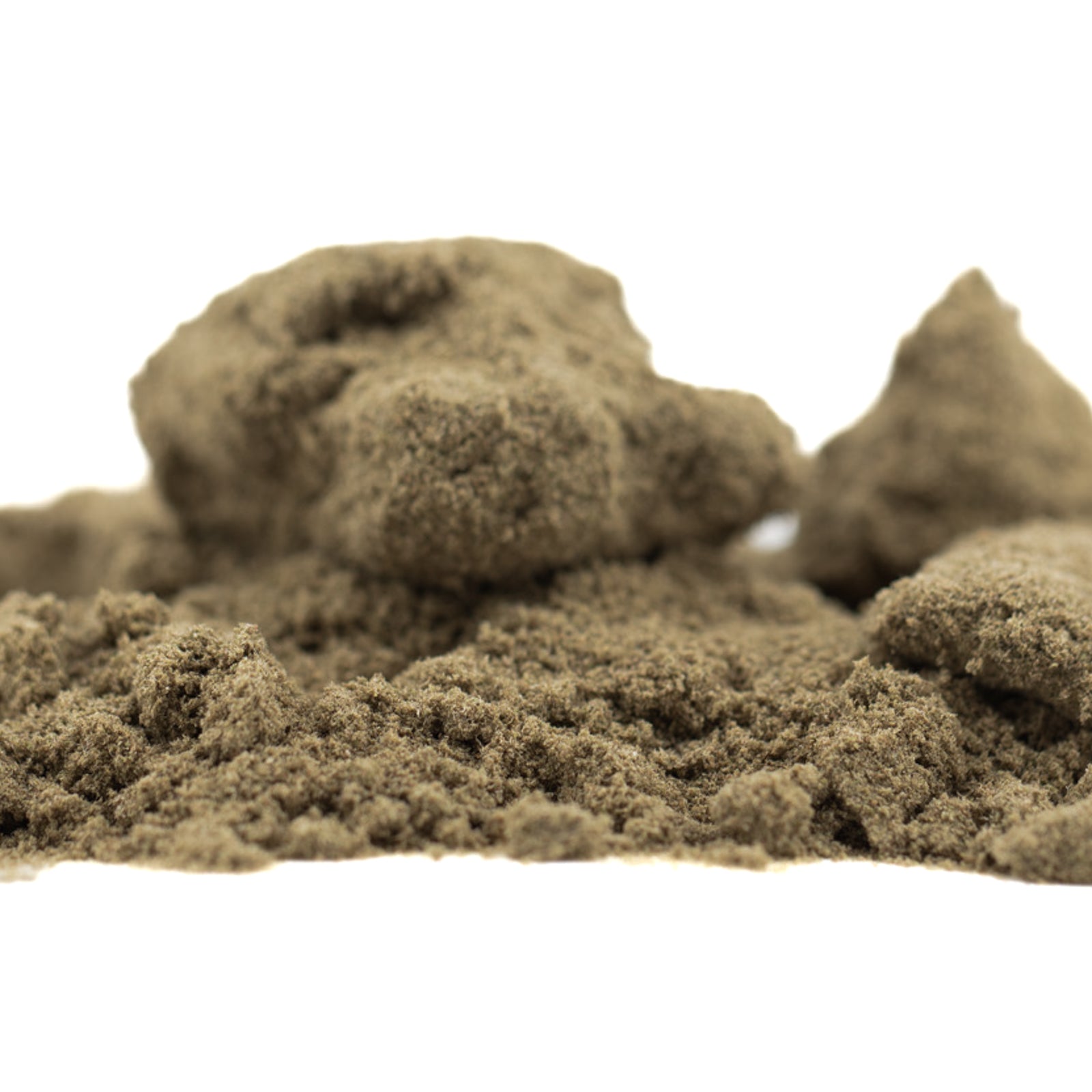 Star Krunch THCA Kief showing light brown sandy hemp flower material with clumps