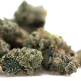 A dense green strawberry diesel indoor thca flower bud with frosty white trichomes and orange pistils