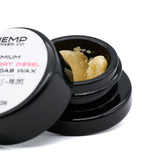 Open black jar of yellow Strawberry Diesel THCA crumble wax with NYC Diesel notes