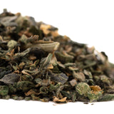 A pile of dried dark green and brownish indoor hemp flower thca trim wholesale for guava tart product use
