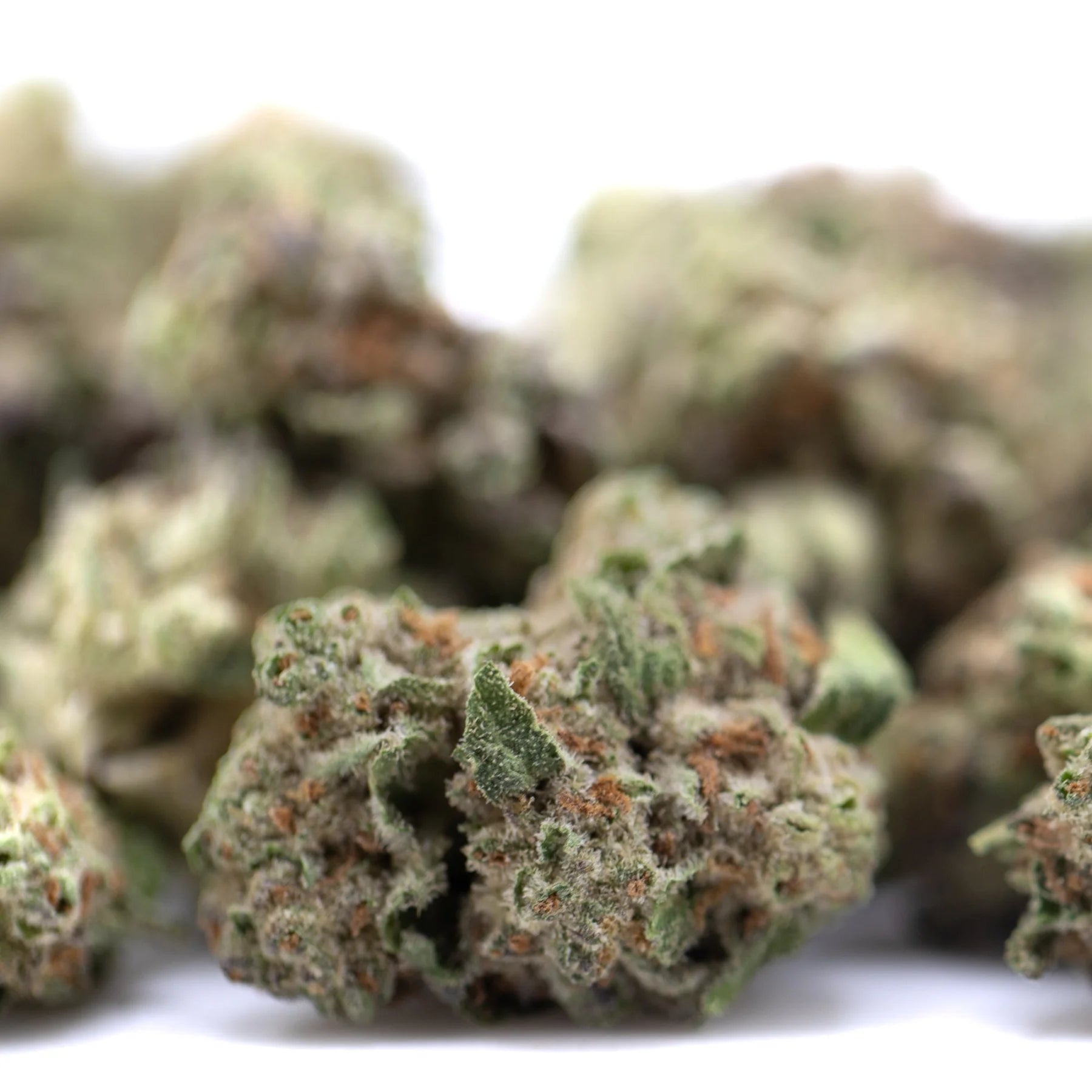 Subzero thca hemp flower greenhouse smalls with green and orange hues and frosty total cannabinoids for body-melting effects