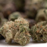 Dried Super Runtz Indoor THCa Flower Smalls with rich trichomes and orange pistils