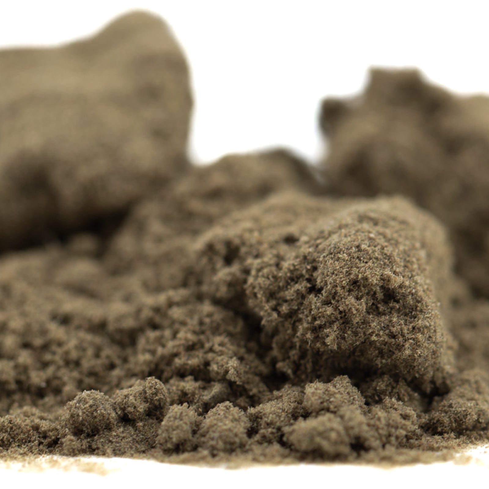 Tangelo THCa Kief showing light brown finely ground powder with clumps, ideal for hemp flower use