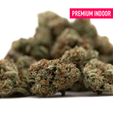 Premium indoor Tropical Punch THCa Flower Smalls with orange hairs and trichomes