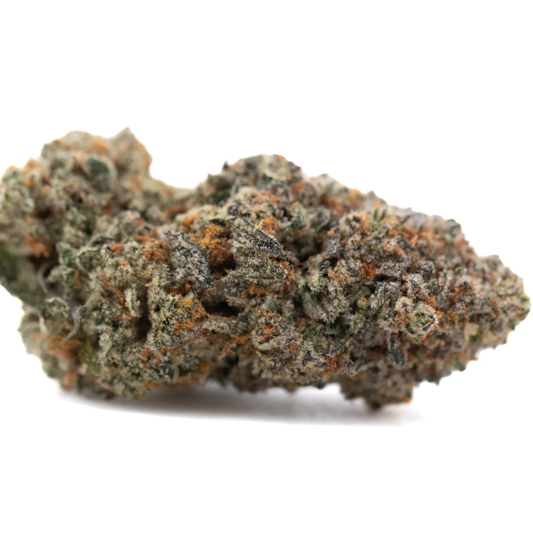 A dense irregular tropical punch indoor thca flower bud covered in green and orange trichomes with skunk x haze aromas
