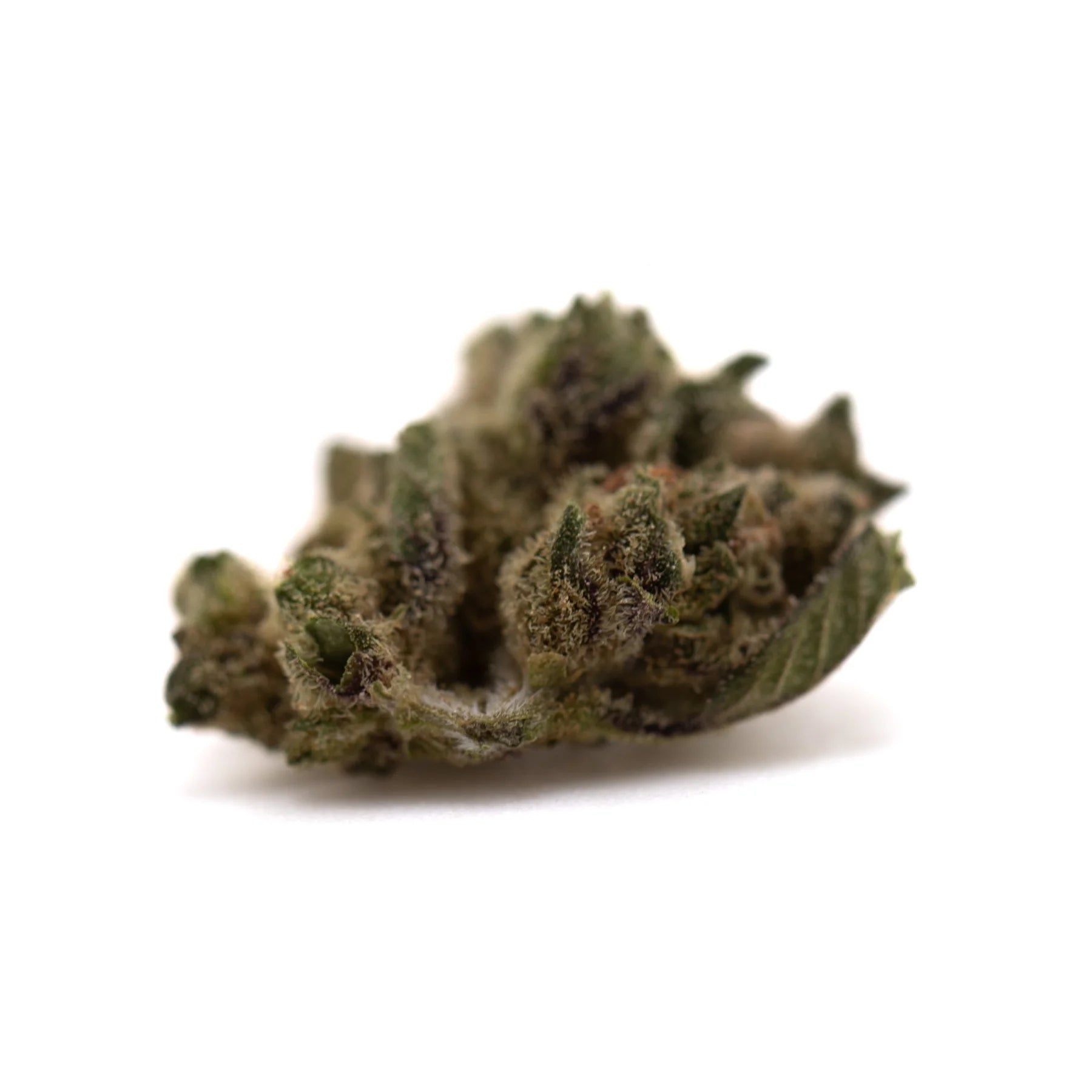 A dense green turtle taffy thca flower smalls hemp bud with fine trichomes and subtle purple hints