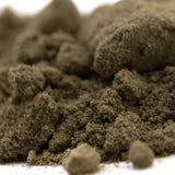 Clumpy earthy-brown granular turtle taffy thca kief with coarse fibrous texture from hemp flower full-term batch