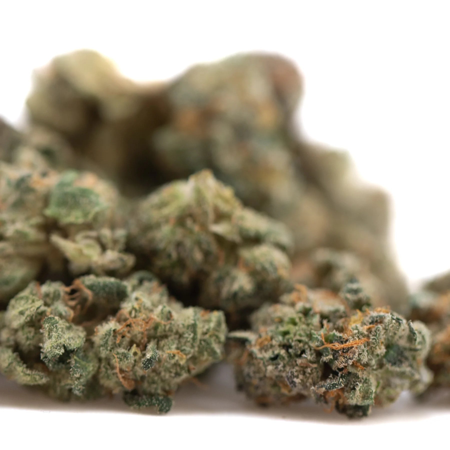 Wedding cake indoor thca flower smalls with green and orange hues and a dense frosty hemp flower texture