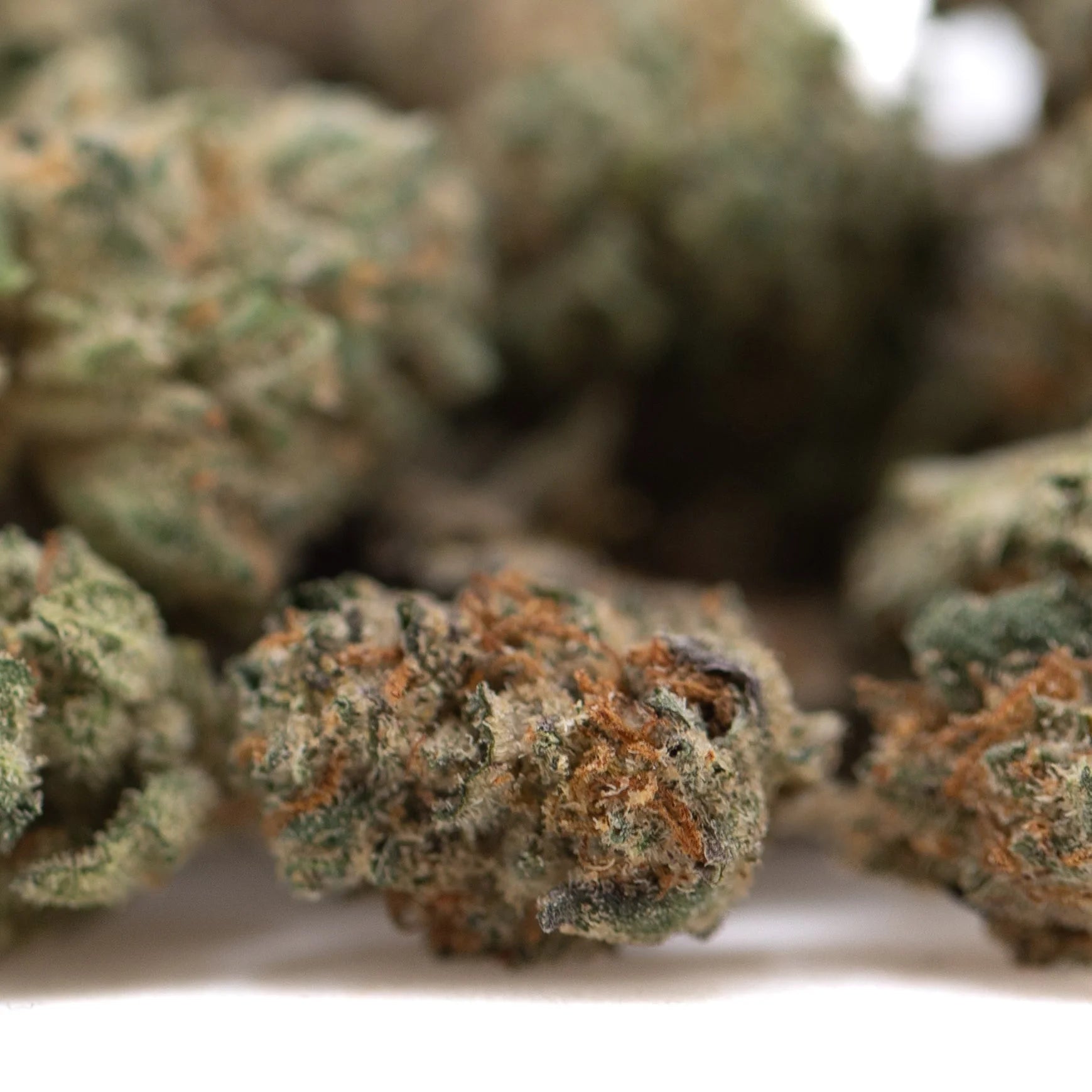 Premium wedding cake indoor thca flower smalls with dense green hemp flower buds and orange pistils