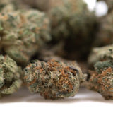 Premium wedding cake indoor thca flower smalls with dense green hemp flower buds and orange pistils