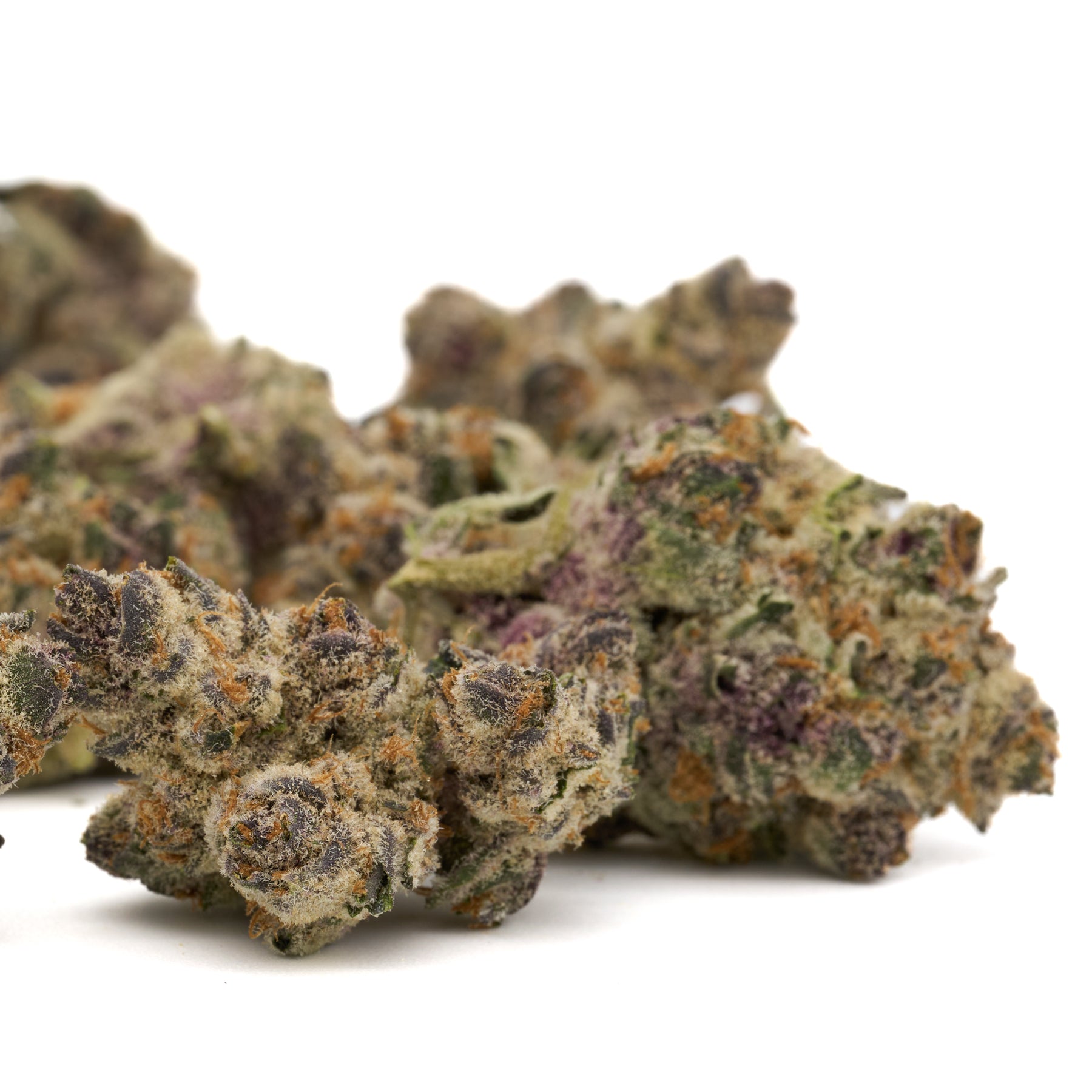 Wedding Cheesecake Indoor THCa Flower with colorful purple, green, orange cannabis buds