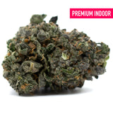 Dense Zkittlez Indoor Hemp Flower with purple hues, orange pistils, and orchard laced sedation